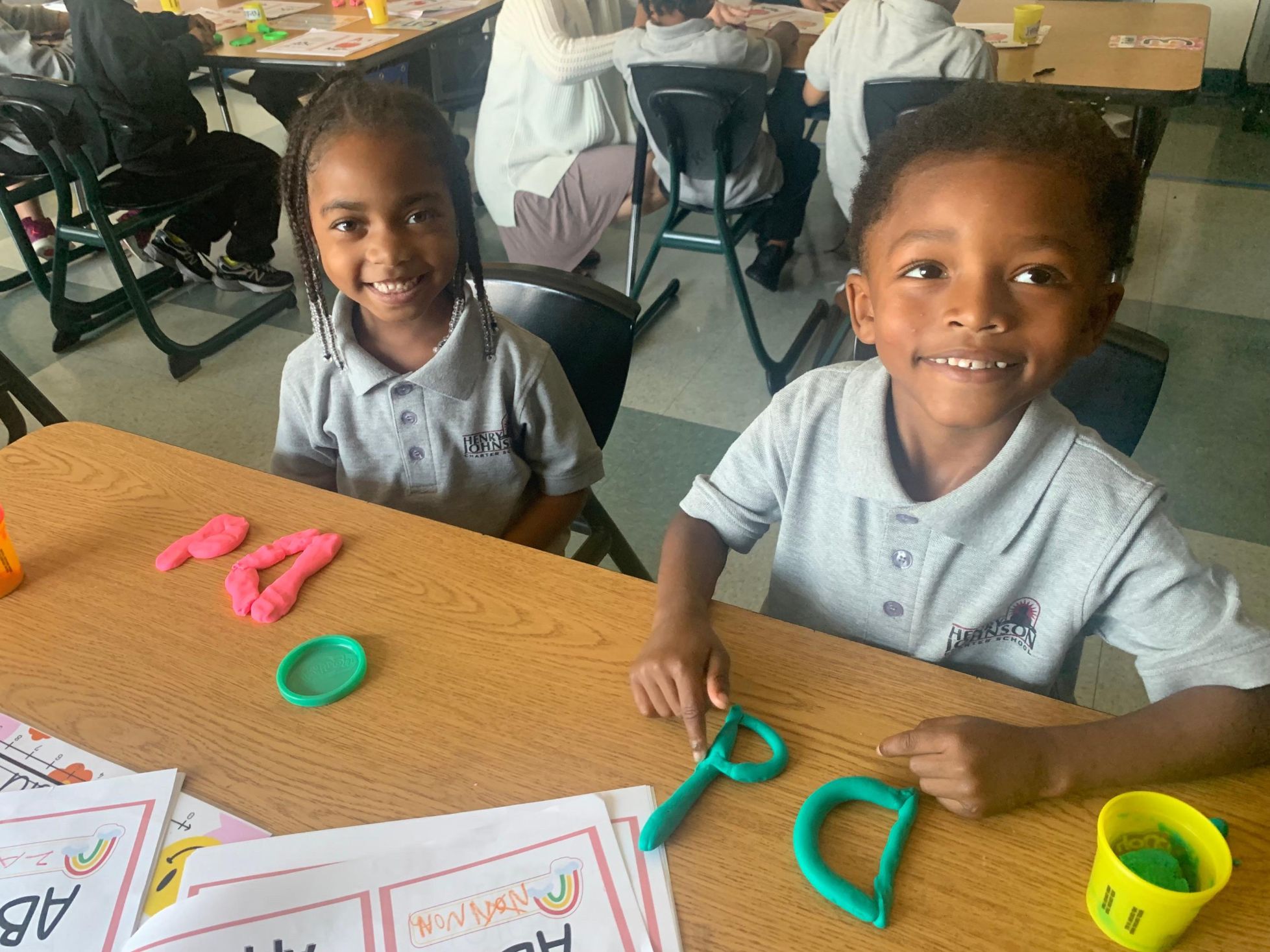 Two children sitting at a desk